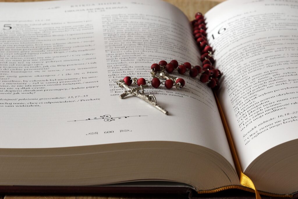 Bible and Rosary. Convey importance of spiritual practices.